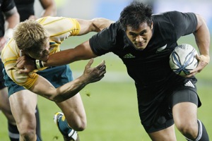 New Zealand's Isaia Toeava, right, tries to fend off Australia's Lachie Turner in their Tri Nations International rugby match at Westpac Stadium in Wellington, New Zealand, Saturday, Sept. 19, 2009. AP Photo/NZPA, Wayne Drought