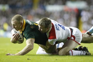 Australia's Luke Lewis, left, is tackled by England's Michael Shenton during their Four Nations Final rugby league match at Elland Road Stadium, Leeds, England, Saturday Nov. 14, 2009. (AP Photo/Jon Super)